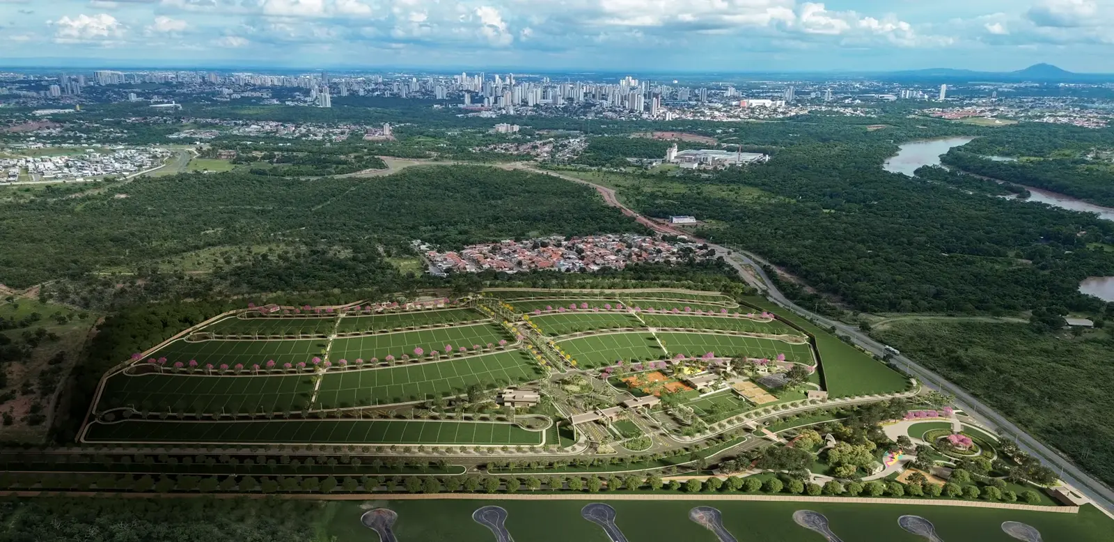 Vista aérea do condomínio com a cidade ao fundo